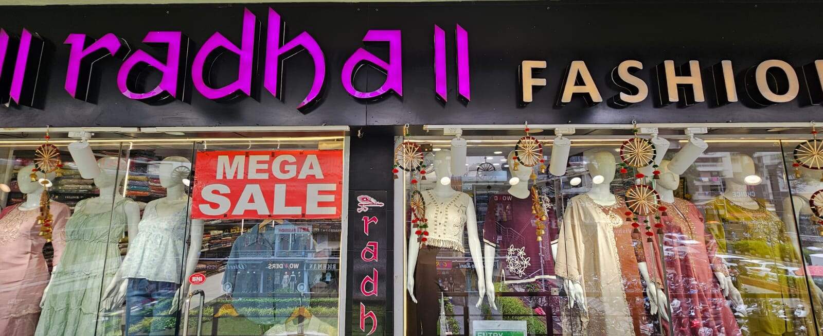 Radha Fashion storefront with pink neon signage on Ghod Dod Road, Surat