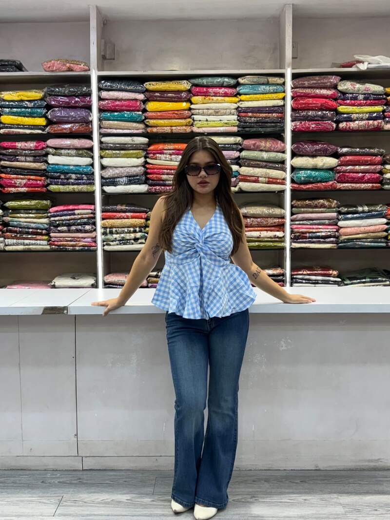 Blue gingham twist-front western top styled with flared denim